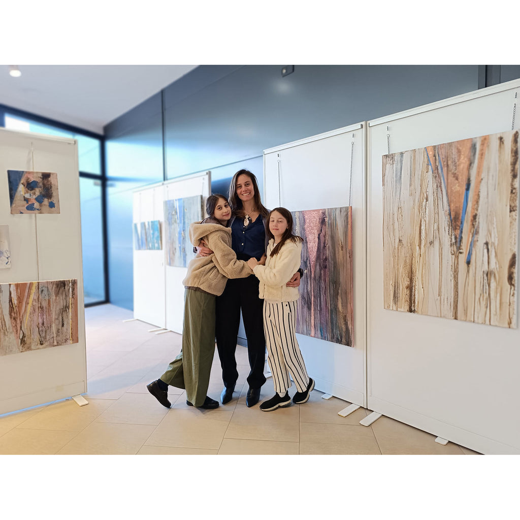 People standing in an art gallery.